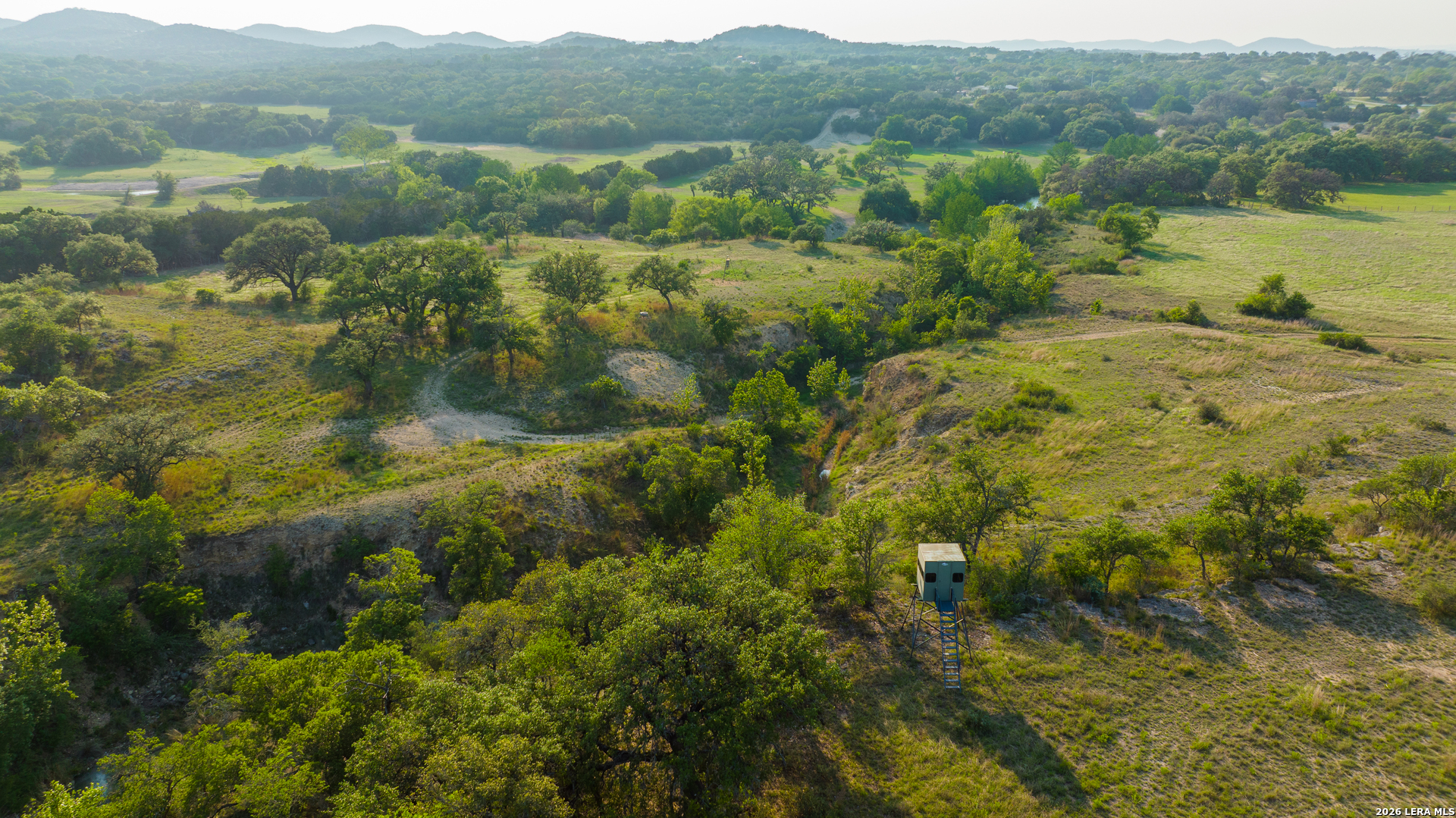 2991 Fm 470 Bandera, TX 78003 - Photo 32 of 46 a view of a lake with mountains in the background
