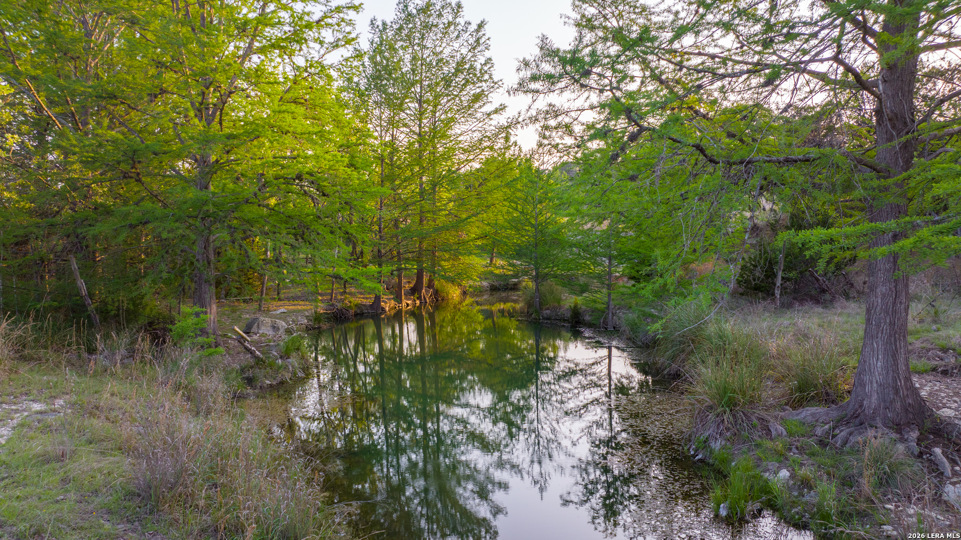 2991 Fm 470 Bandera, TX 78003 - Photo 34 of 46 a view of a lake with lots of green space and trees