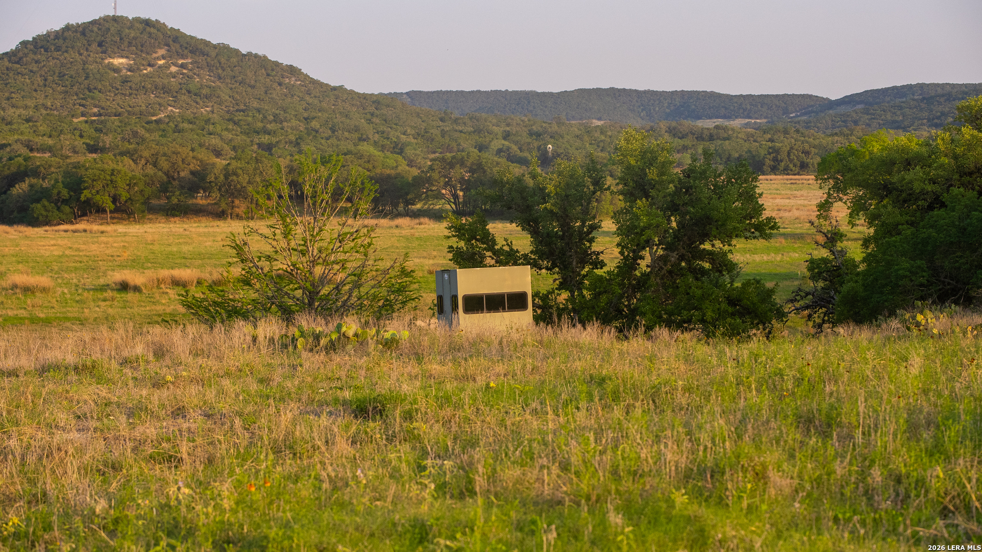 2991 Fm 470 Bandera, TX 78003 - Photo 5 of 46 a view of a lake with mountains in the background