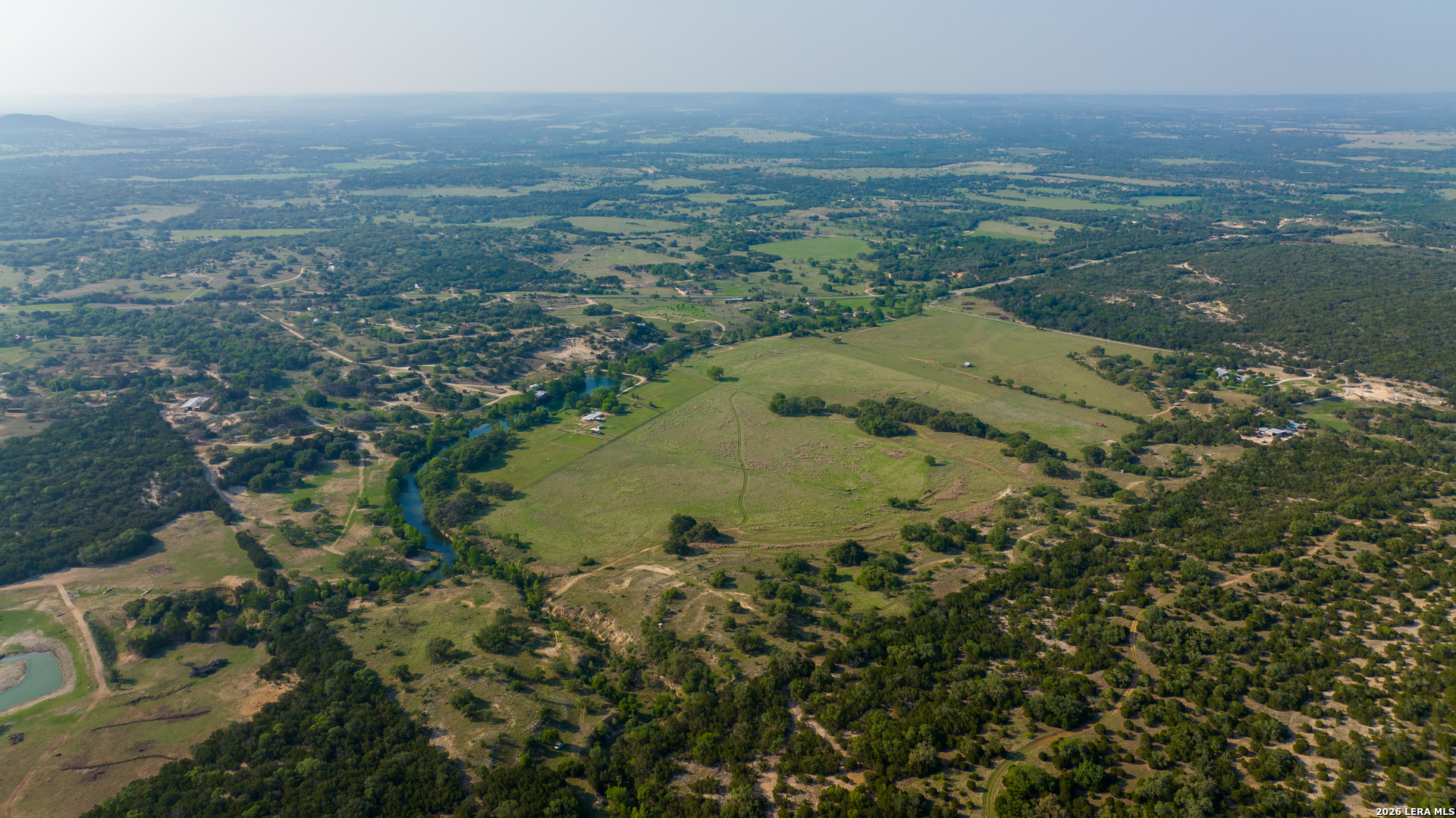 2991 Fm 470 Bandera, TX 78003 - Photo 6 of 46 an aerial view of residential house and lake
