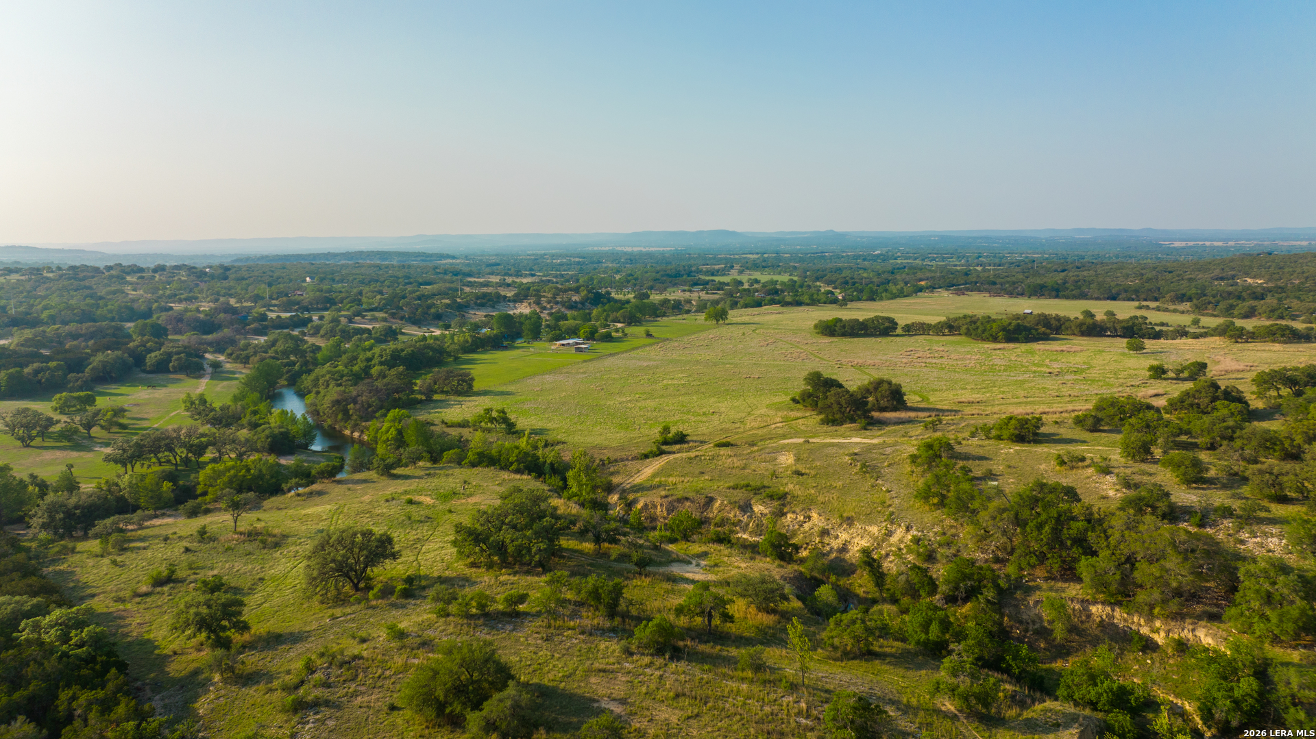 2991 Fm 470 Bandera, TX 78003 - Photo 7 of 46 a view of a lake with houses in the back