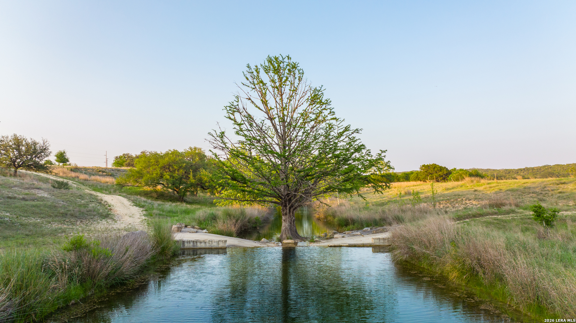2991 Fm 470 Bandera, TX 78003 - Photo 8 of 46 a view of lake with green space