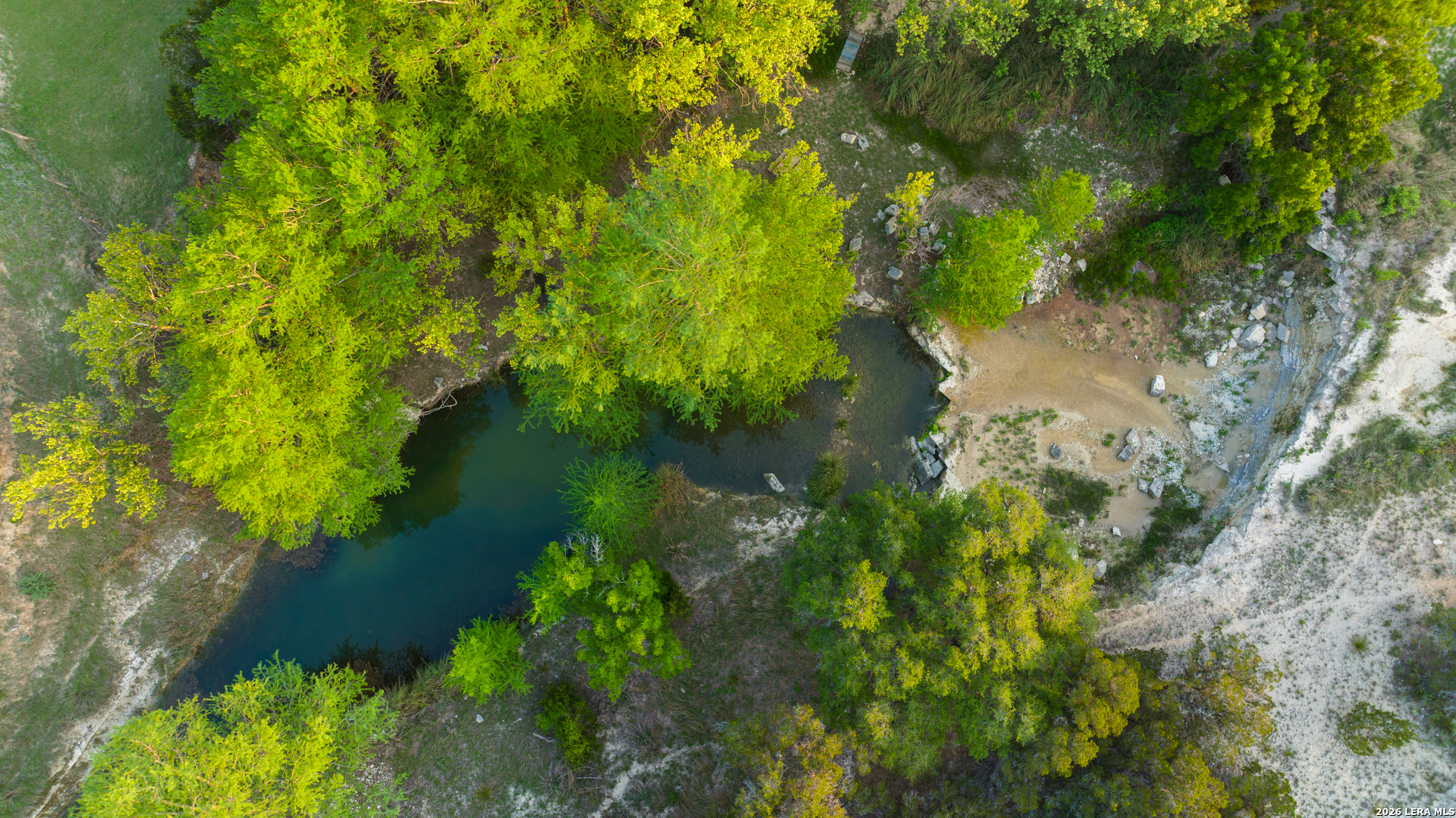 2991 Fm 470 Bandera, TX 78003 - Photo 10 of 46 a view of a lake with a yard