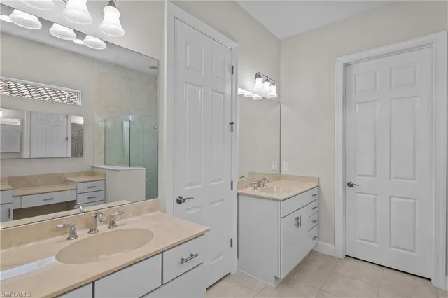 a bathroom with a sink vanity and a mirror