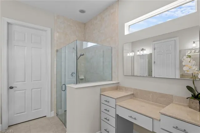 a en suite bathroom with a sink and mirror