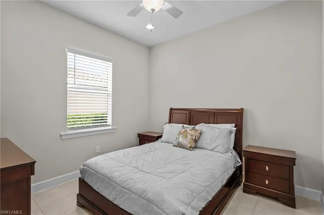 a bedroom with a bed and a night stand