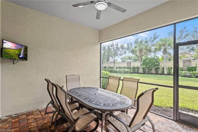 a view of a dining room with furniture window and outside view