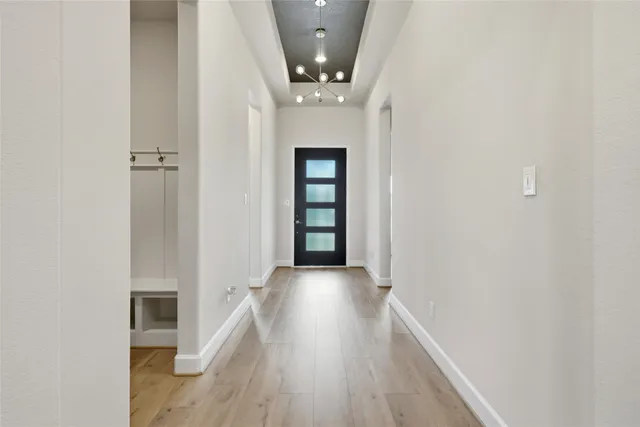 wooden floor in a hall with a window