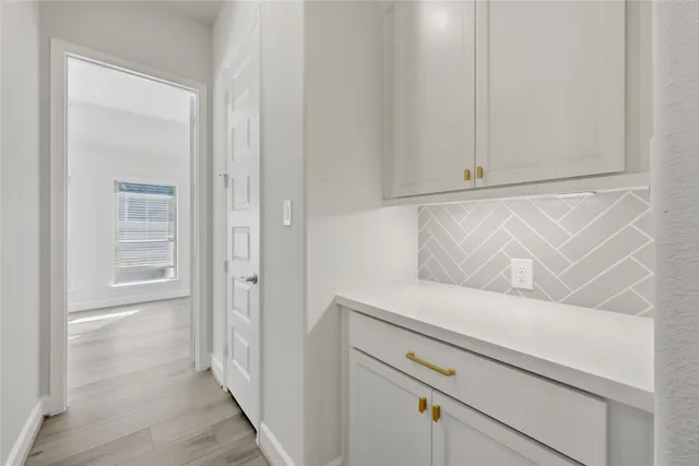 a view of an entryway with hallway