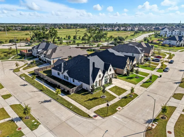 an aerial view of a house with a ocean view