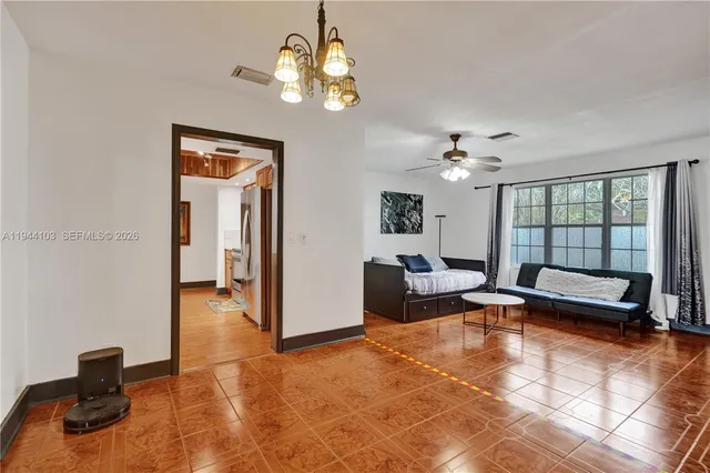 a bedroom with a bed and dresser