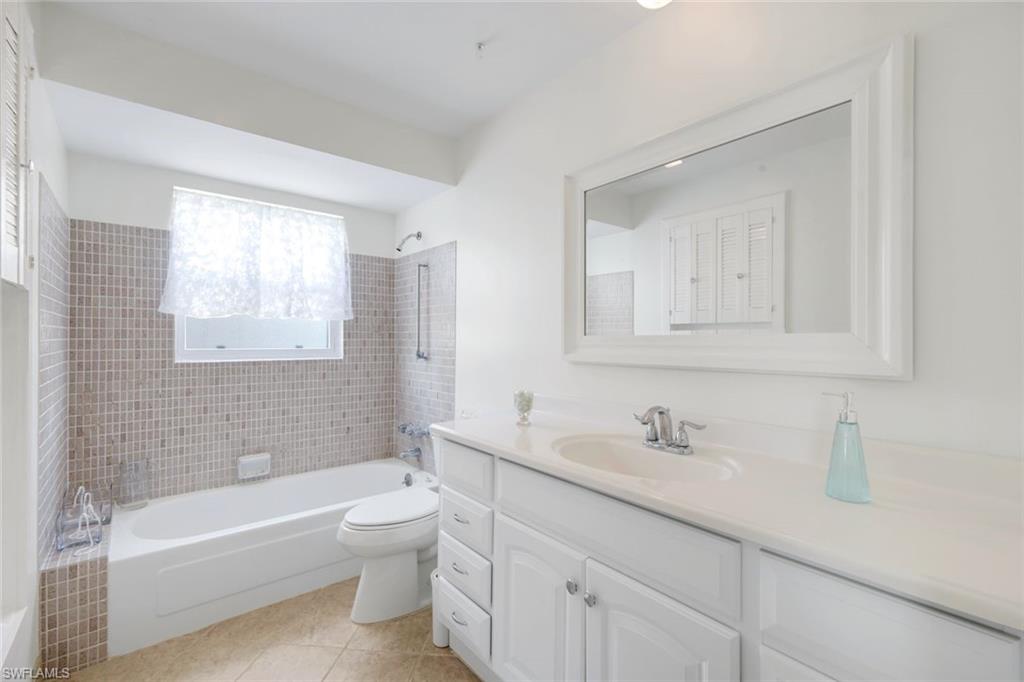 59 Hilo Court, Unit 59 Naples, FL 34112 - Photo 18 of 25 a bathroom with a sink a toilet and bathtub