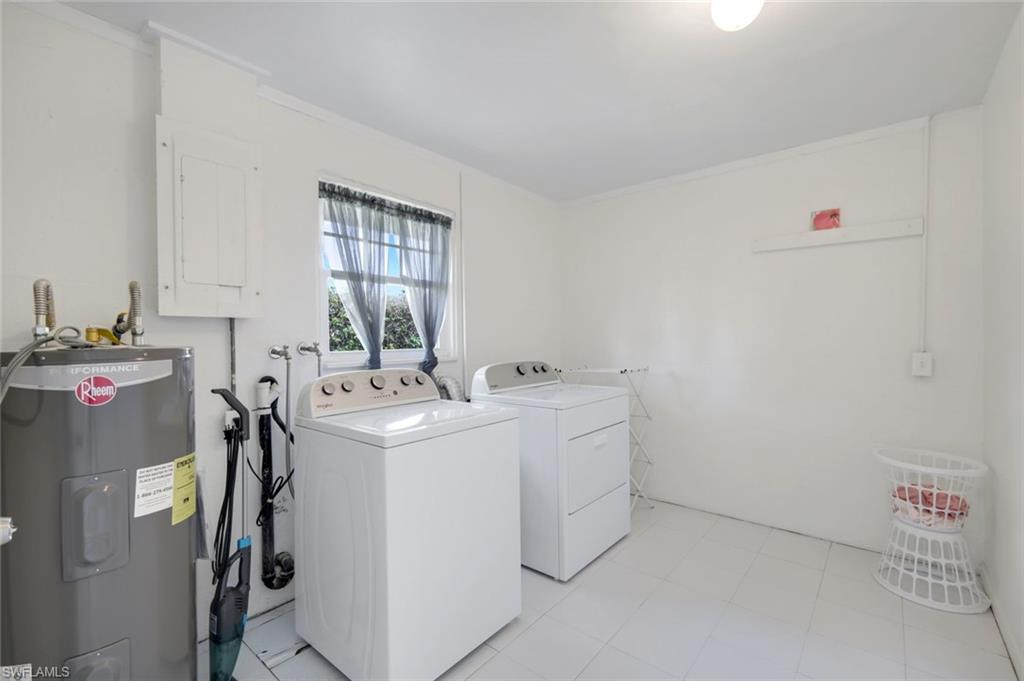 59 Hilo Court, Unit 59 Naples, FL 34112 - Photo 20 of 25 a utility room with dryer and washer
