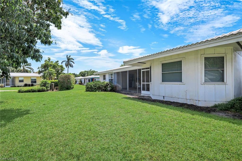59 Hilo Court, Unit 59 Naples, FL 34112 - Photo 23 of 25 a view of a house with backyard and garden