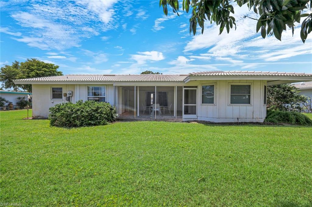59 Hilo Court, Unit 59 Naples, FL 34112 - Photo 24 of 25 a view of house with a garden