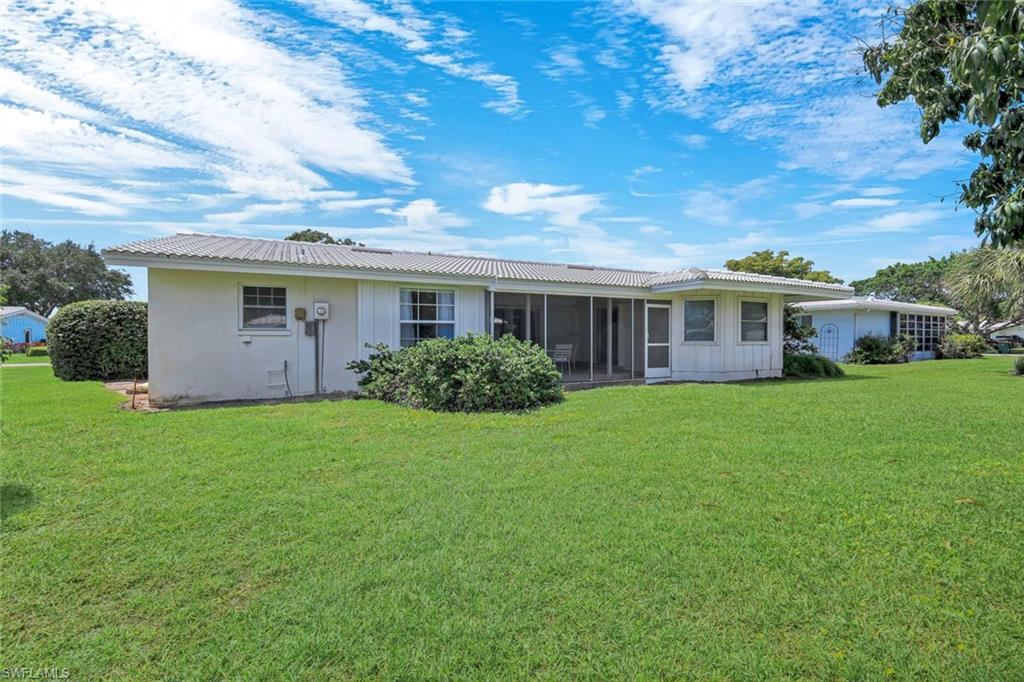 59 Hilo Court, Unit 59 Naples, FL 34112 - Photo 25 of 25 a view of a house with backyard and garden
