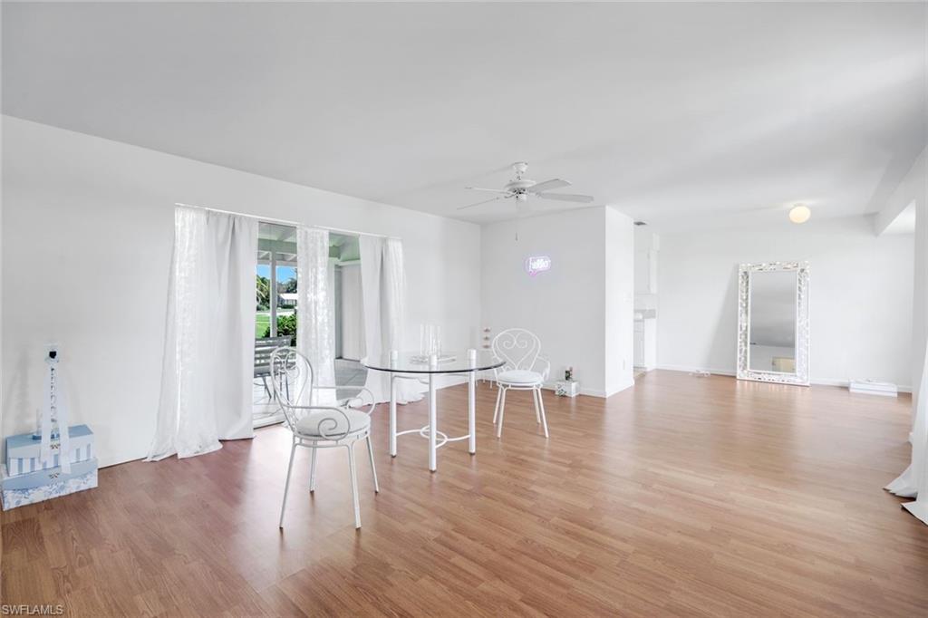 59 Hilo Court, Unit 59 Naples, FL 34112 - Photo 6 of 25 a view of a livingroom with furniture wooden floor and windows