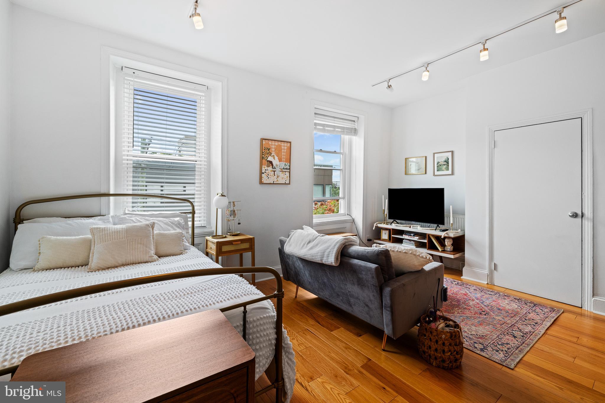726 South 19th Street Philadelphia, PA 19146 - Photo 3 of 12 a bedroom with a bed and a couch