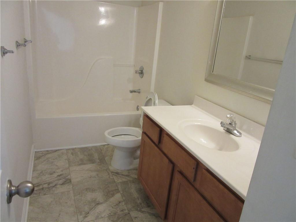 3357 Wyesham Circle Duluth, GA 30096 - Photo 19 of 26 a bathroom with a sink a toilet and shower