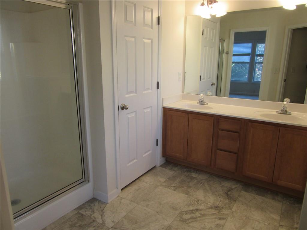 3357 Wyesham Circle Duluth, GA 30096 - Photo 22 of 26 a bathroom with a sink and mirror