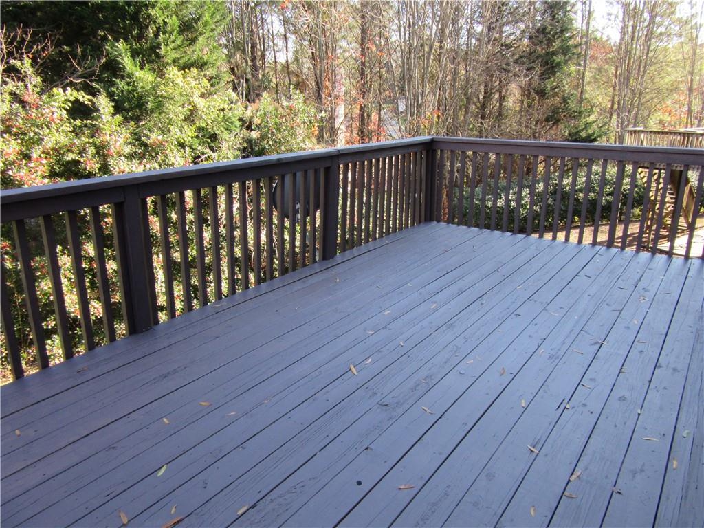 3357 Wyesham Circle Duluth, GA 30096 - Photo 26 of 26 a balcony with wooden floor and trees in the back