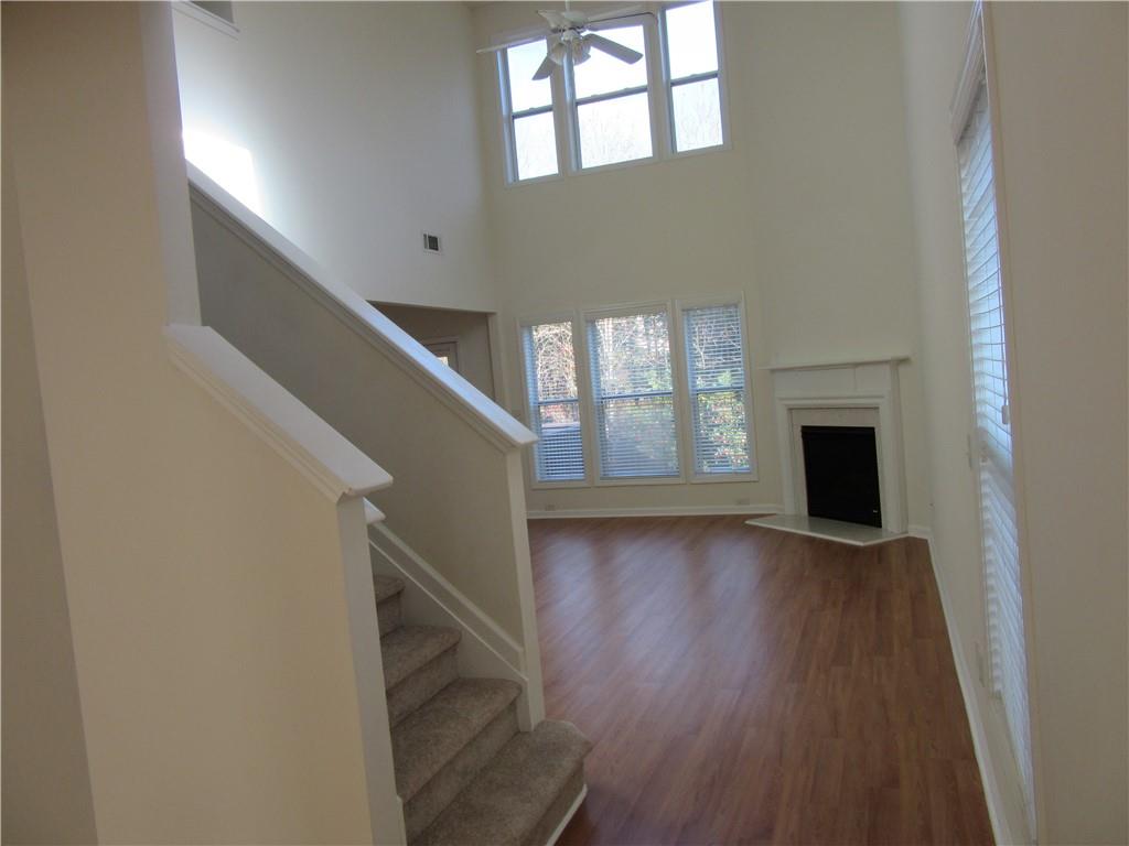 3357 Wyesham Circle Duluth, GA 30096 - Photo 4 of 26 a view of an empty room with wooden floor and a window