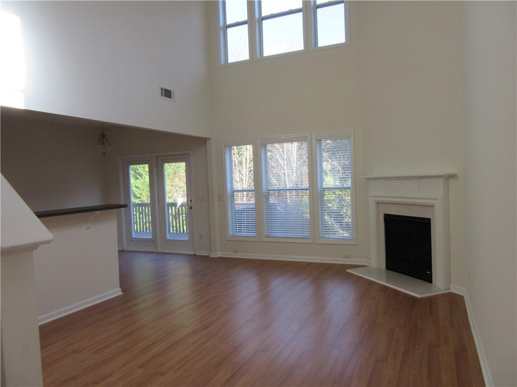 3357 Wyesham Circle Duluth, GA 30096 - Photo 5 of 26 a view of an empty room with wooden floor and a window
