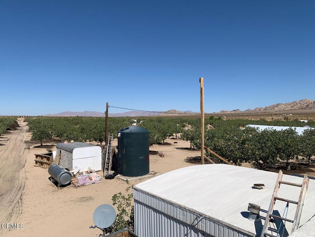 10080 Santa Fe Fire Road Lucerne Valley, CA 92356 - Photo 19 of 36 a view of a terrace with couches and city view