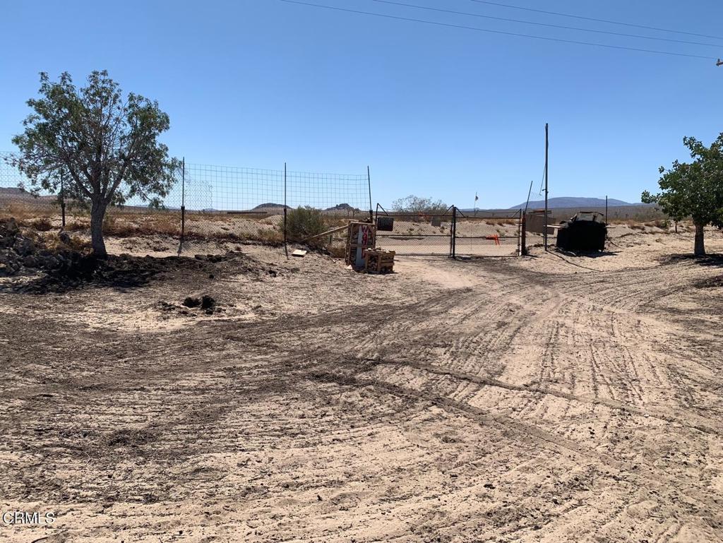 10080 Santa Fe Fire Road Lucerne Valley, CA 92356 - Photo 7 of 36 a view of a backyard of the house