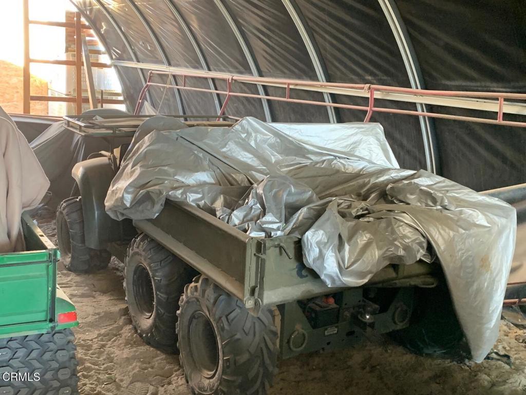 10080 Santa Fe Fire Road Lucerne Valley, CA 92356 - Photo 10 of 36 a bed with white sheets and pillows on it