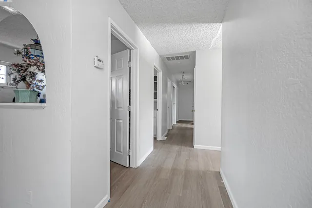 a bathroom with a shower sink vanity mirror and toilet