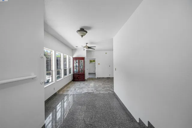 a view of an empty room with a window