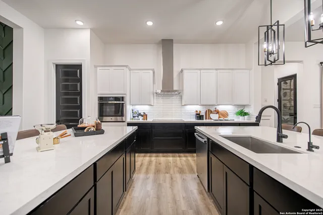 a kitchen with a sink stove and cabinets