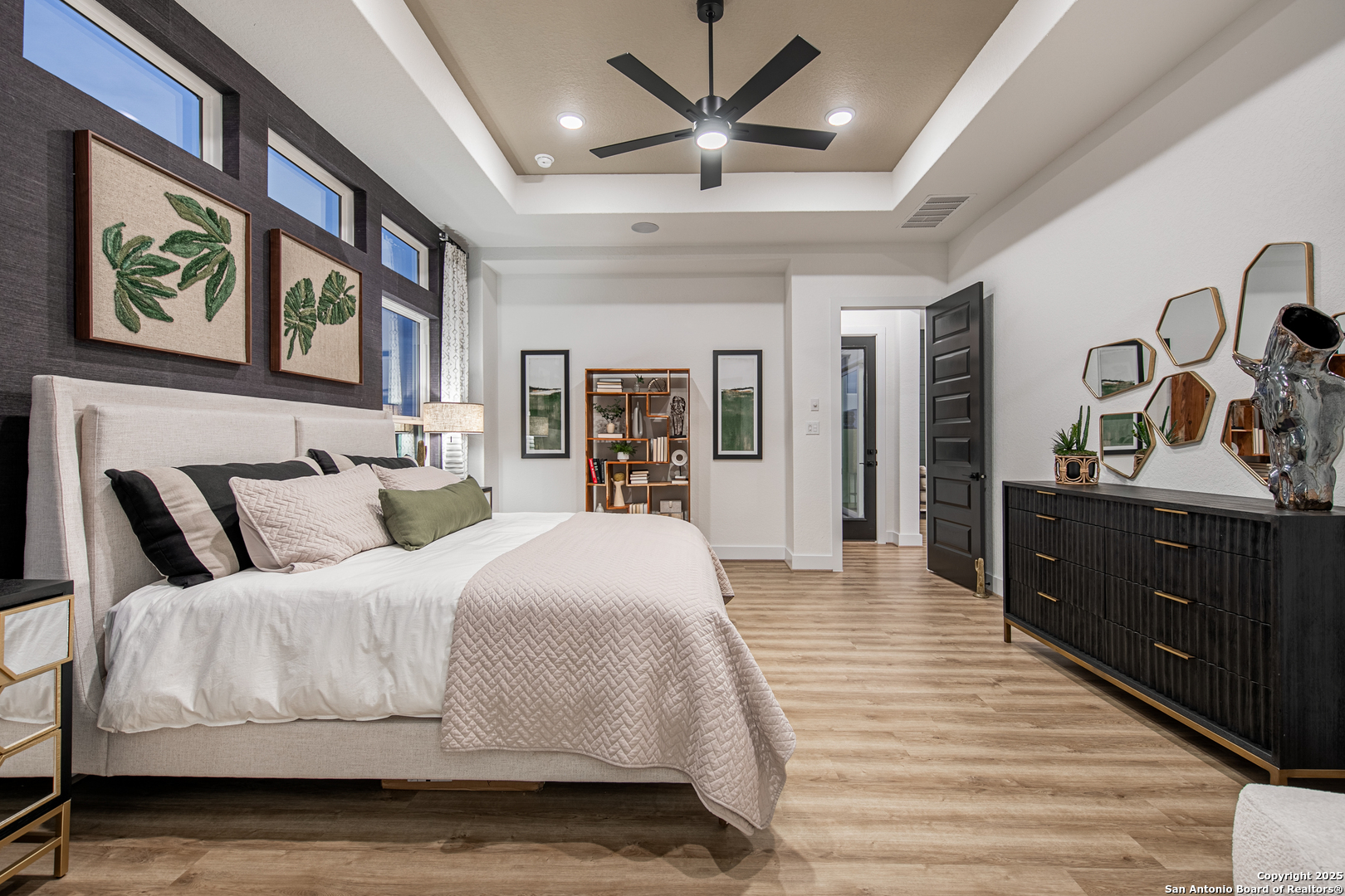 527 Corwin Springs Cibolo, TX 78108 - Photo 15 of 21 a spacious bedroom with a large bed and a chandelier