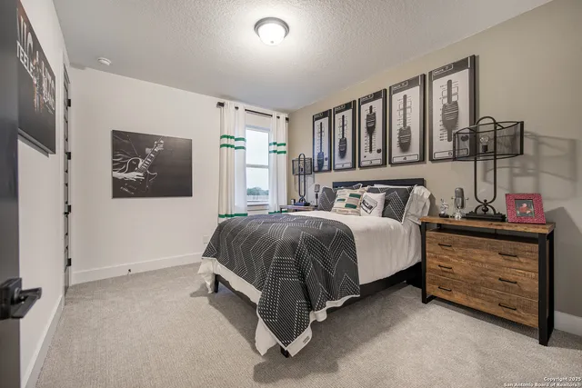 a spacious bedroom with a bed and a window