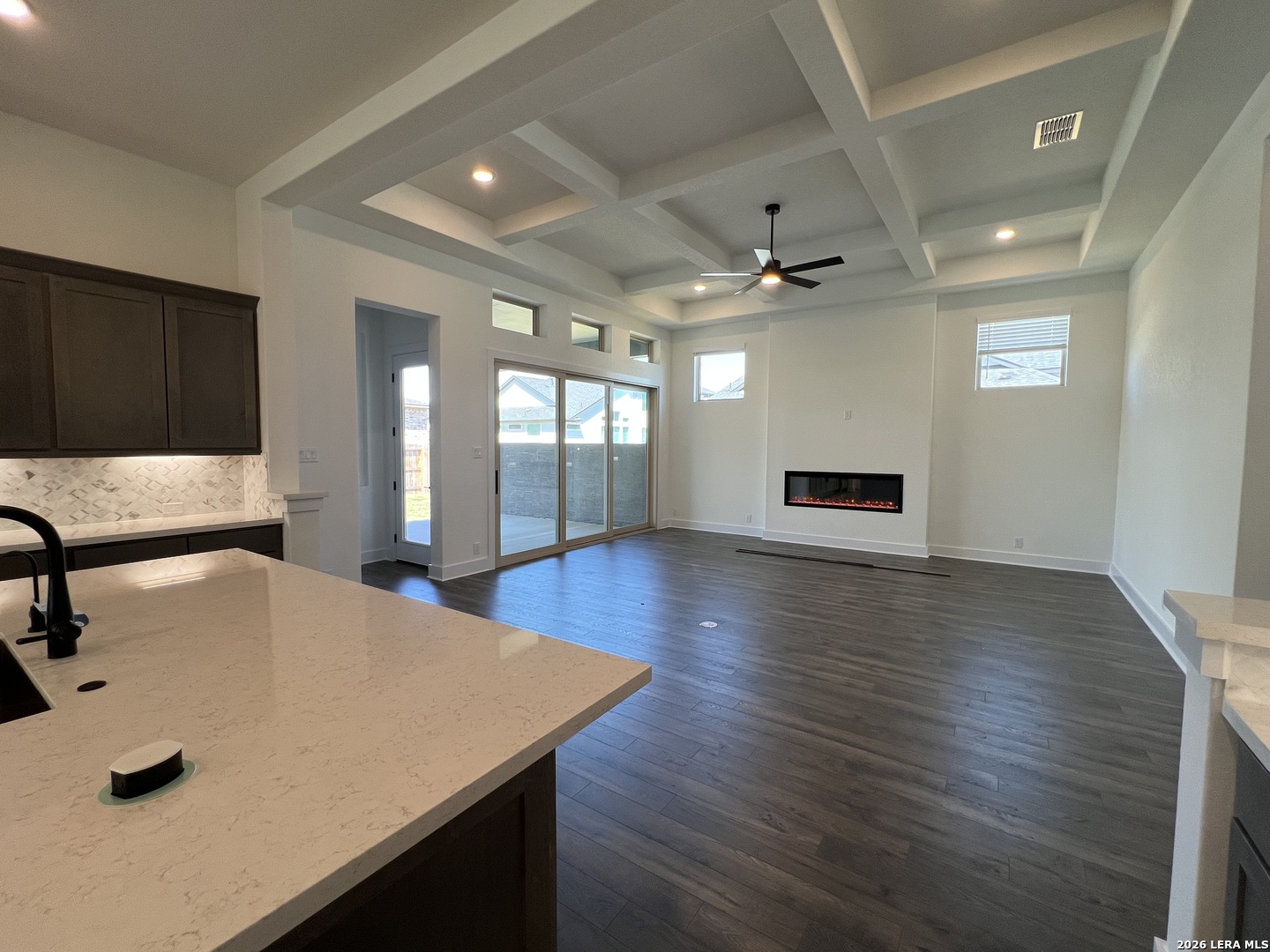 527 Corwin Springs Cibolo, TX 78108 - Photo 5 of 21 a view of a kitchen with a sink a refrigerator and wooden floor