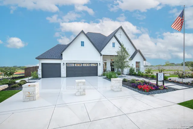 a front view of a house with sitting area