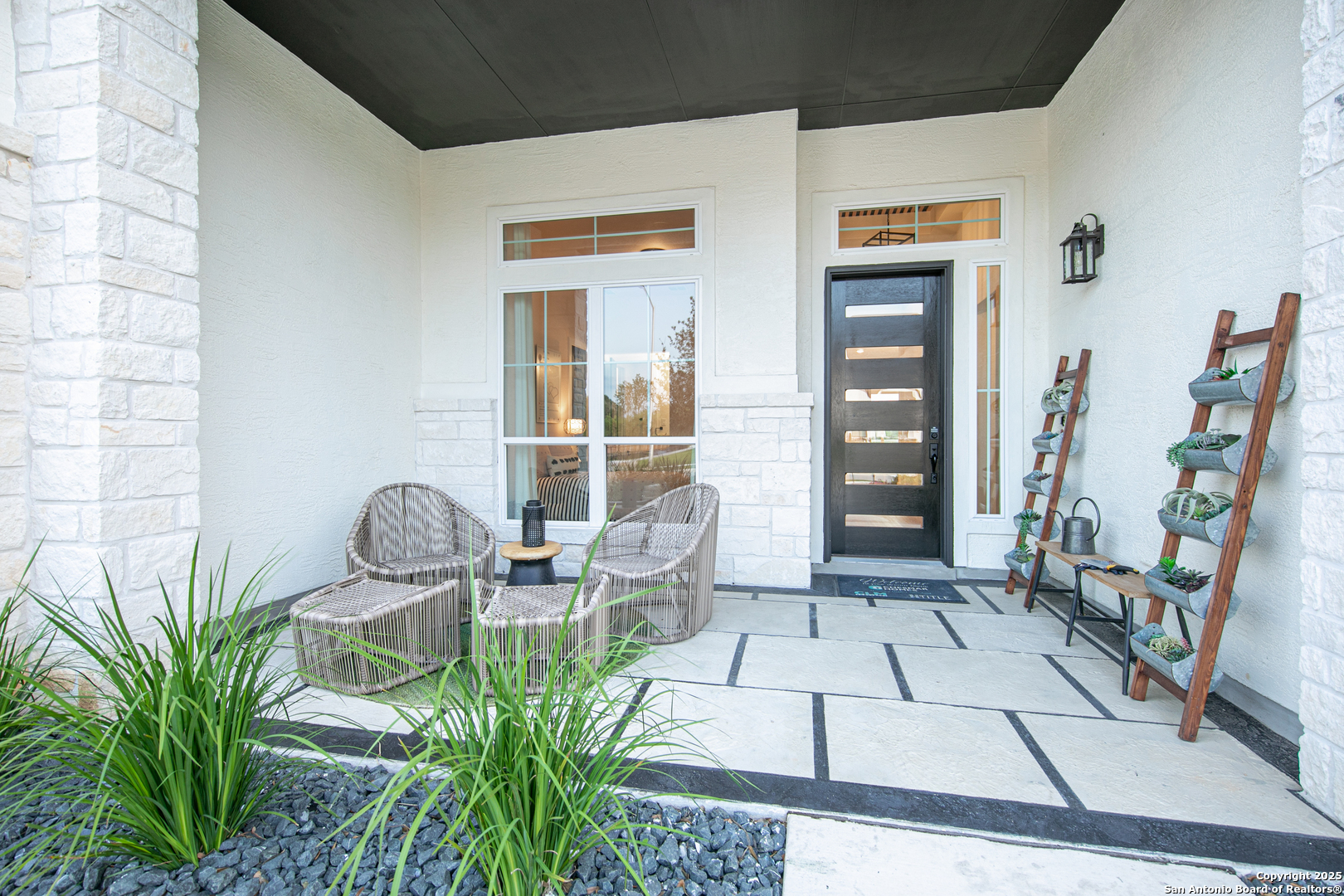 527 Corwin Springs Cibolo, TX 78108 - Photo 7 of 21 a front view of a house with outdoor seating and plants