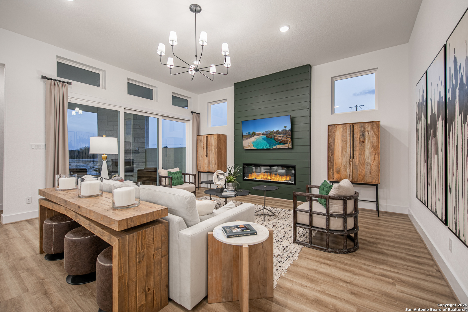 527 Corwin Springs Cibolo, TX 78108 - Photo 10 of 21 a view of a dining room with furniture a chandelier and wooden floor