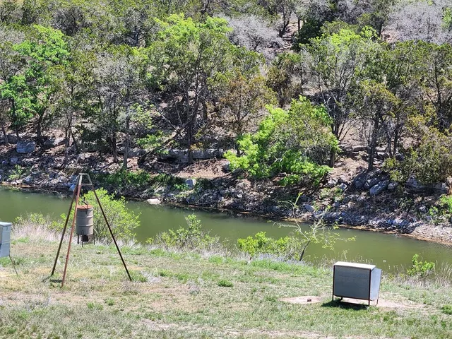 a lake view with a wooden bridge