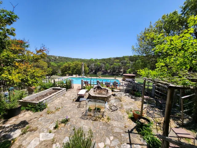 a view of swimming pool with a patio