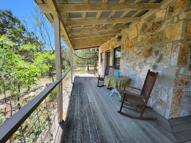 a view of chairs in wooden deck