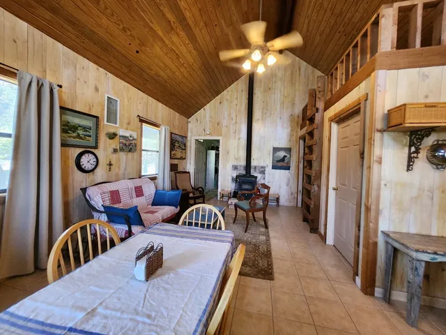 a view of a patio with dining table and chairs