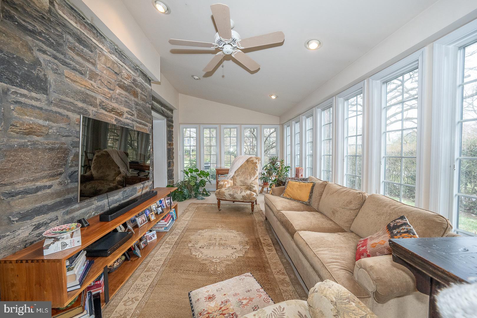 517 Howe Road Merion Station, PA 19066 - Photo 11 of 71 a living room with furniture a flat screen tv and a fireplace