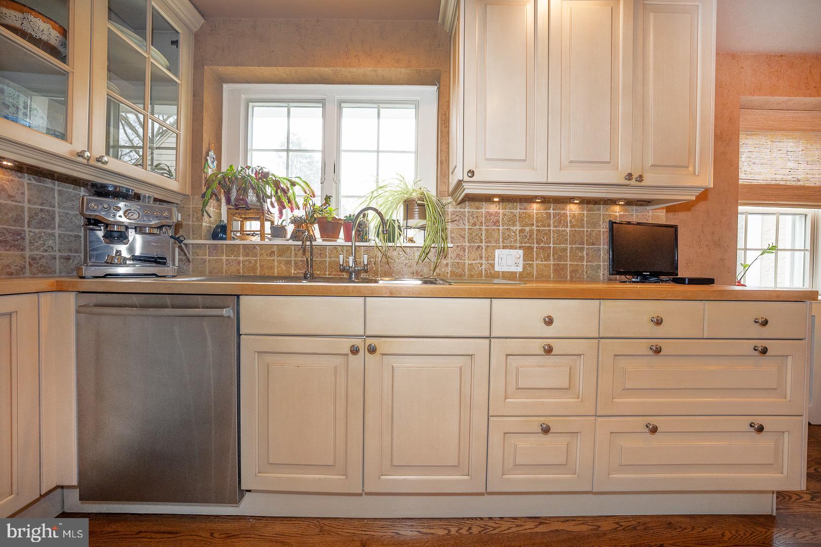 517 Howe Road Merion Station, PA 19066 - Photo 24 of 71 a kitchen with granite countertop white cabinets and window