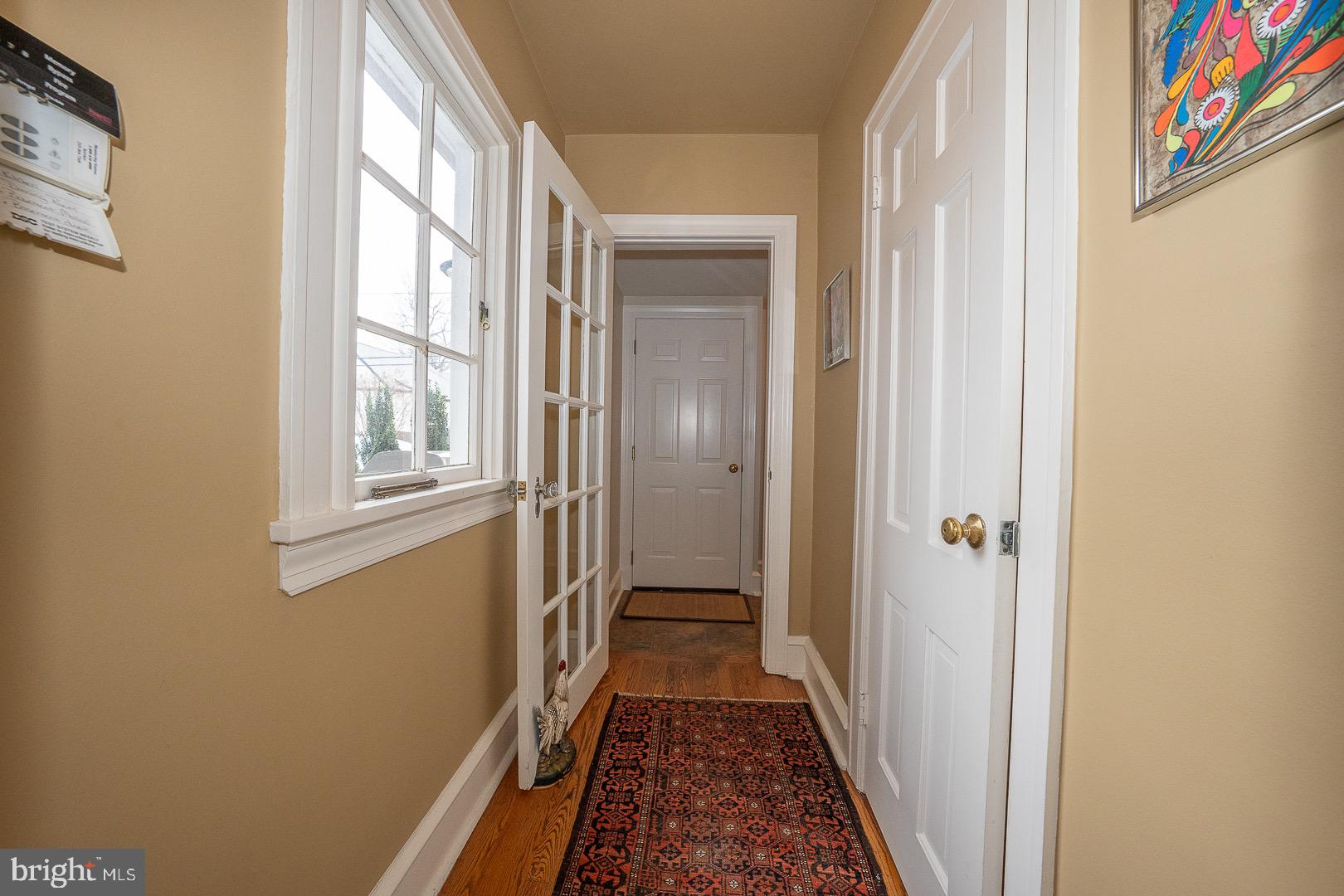 517 Howe Road Merion Station, PA 19066 - Photo 25 of 71 a view of a hallway with wooden floor and a bathroom