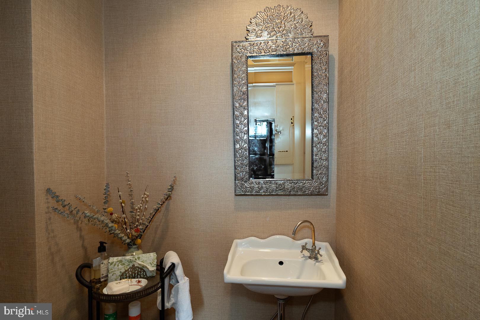 517 Howe Road Merion Station, PA 19066 - Photo 26 of 71 a bathroom with a sink a mirror and a toilet