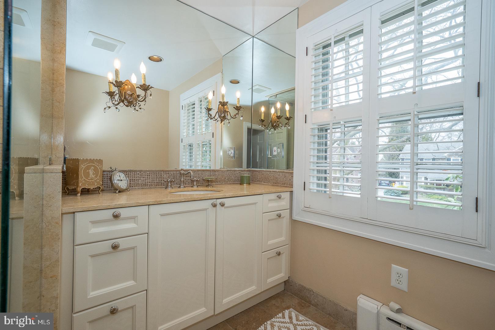 517 Howe Road Merion Station, PA 19066 - Photo 39 of 71 a bathroom with a double vanity sink and a mirror