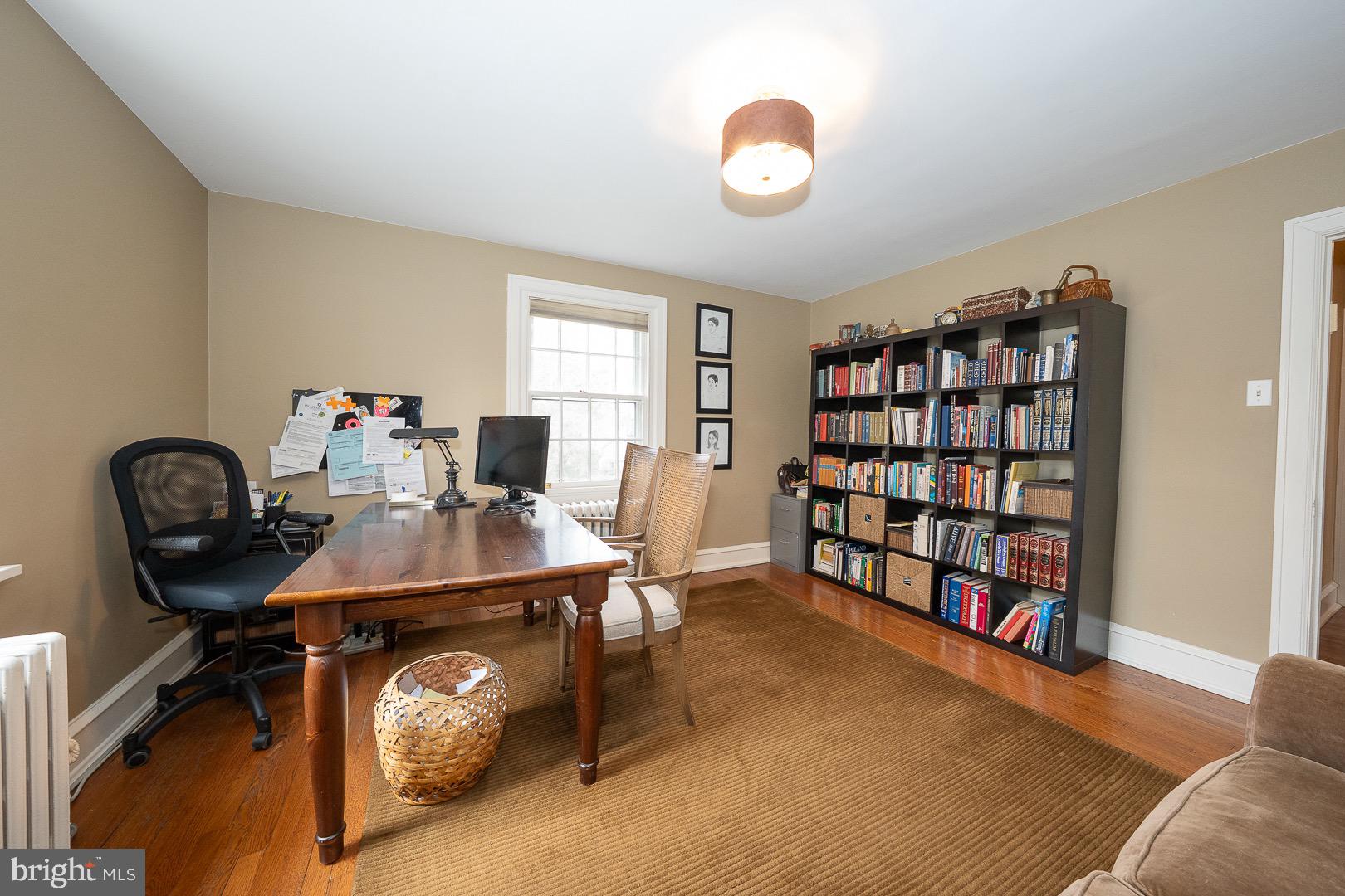 517 Howe Road Merion Station, PA 19066 - Photo 42 of 71 a view of a workspace with a bookshelf and a workspace