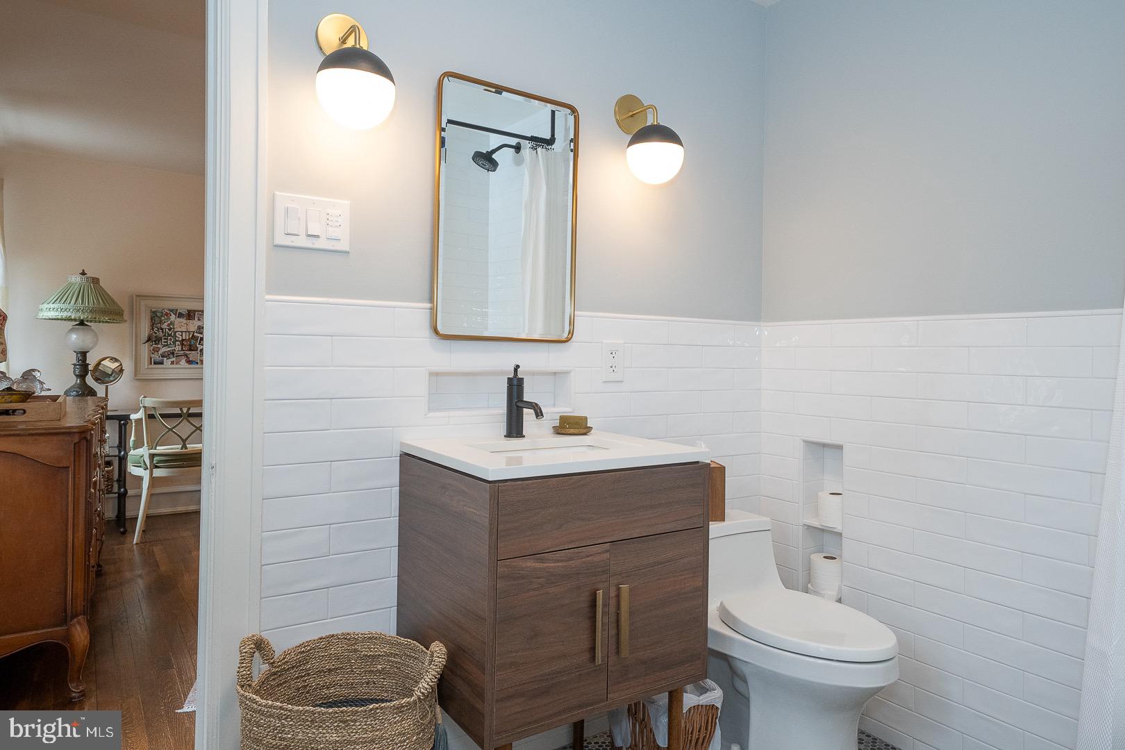 517 Howe Road Merion Station, PA 19066 - Photo 48 of 71 a bathroom with a toilet a sink and a mirror